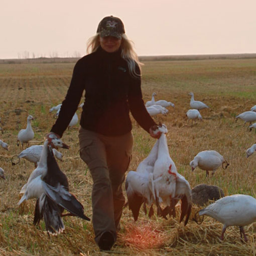 dog has duck on its mouth